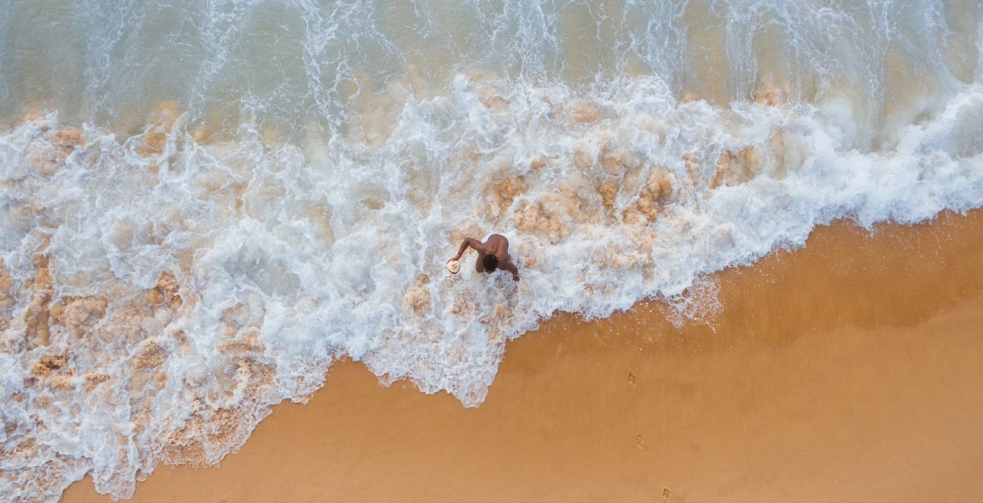 person walking on shore