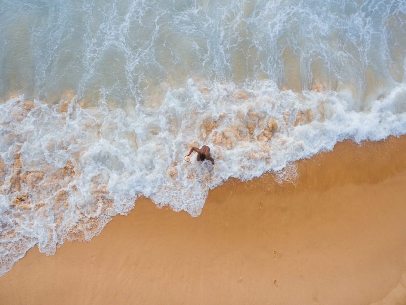 person walking on shore